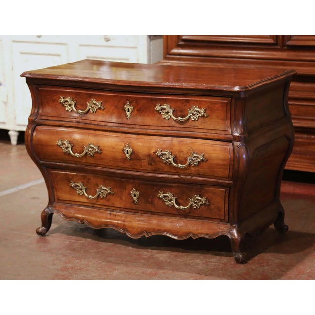 Crafted in Bordeaux, France, circa 1760, this elegant antique “Commode Tombeau” exemplifies the graceful curves and...