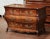 Crafted in Bordeaux, France, circa 1760, this elegant antique “Commode Tombeau” exemplifies the graceful curves and...