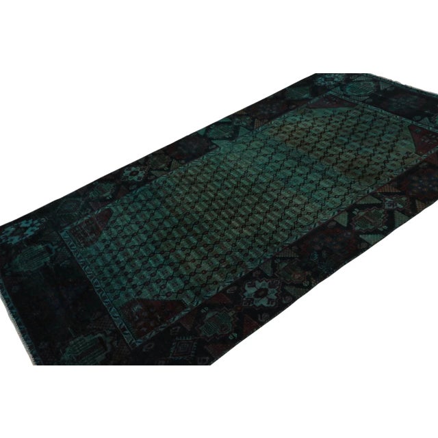 From our new collection of overdyed rugs, a vintage 4x9 Persian rug originating circa 1970-1980 or possibly earlier. On...