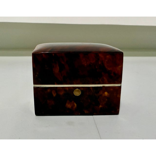 An early 19th-century Dutch tortoiseshell perfume bottle box, circa 1830, of compact rectangular form with a softly domed...
