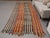 Vintage Hand-Knotted runner rug is a semi-antique vintage area rug. The '70s Eastern region of Anatolia's unique rug is...