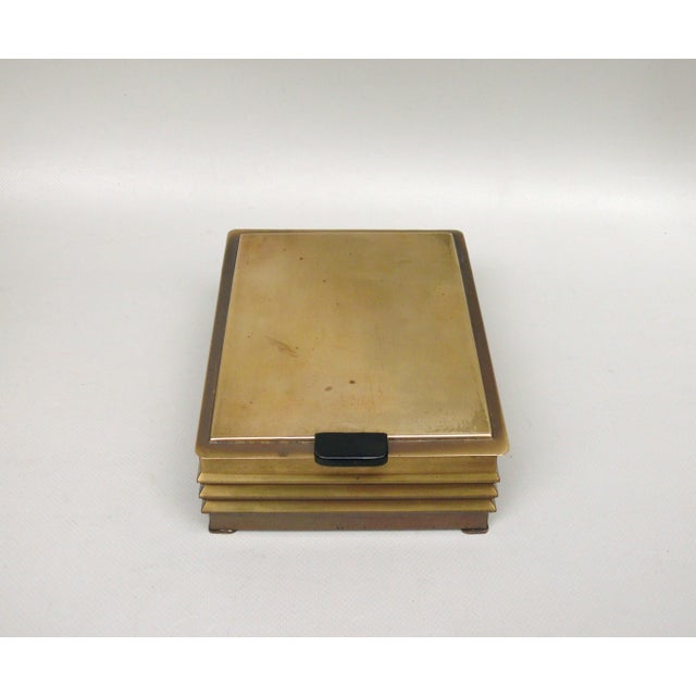 An exceptionally crafted lidded tobacco box from the Art Deco period, made in Germany. The box is elaborately and...