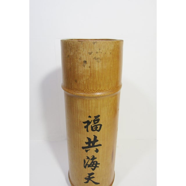 This vintage Chinese scholar’s brush pot is crafted from solid bamboo and hand-painted with calligraphy reading “Blessing...