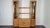 - Solid English elm sideboard with display cabinet - Produced by Ercol during the 1990s - Adjustable level feet - Original...