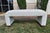 A custom upholstered waterfall bench. In new condition. Off-white textile from LEE Industries used for the upholstery. The...
