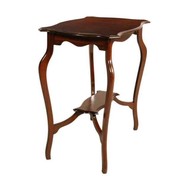 Elegant, precious and refined venetian service table, baroque, in wax-polished solid walnut with exceptional patina. Built...