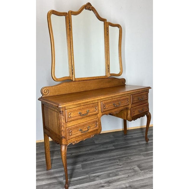 A beautifully crafted Vintage French Louis dressing table , showcasing graceful curves, ornate carved details and a...