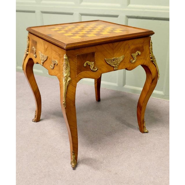 French Empire Style Burr Walnut and Ormolu Games Table, Chess and Backgammon This is a charming piece, the table stands on...