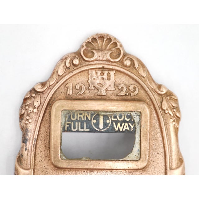 This authentic piece from the late 1920s is an ornamental, polished cast bronze thumb turn latch. The medallion shaped...