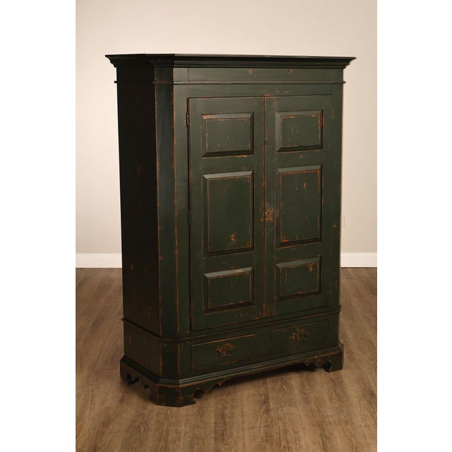 High Quality American Made Country Primitive Style Armoire Featuring A Deep Green Painted Finish With Intentional...