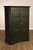 High Quality American Made Country Primitive Style Armoire Featuring A Deep Green Painted Finish With Intentional...