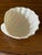 Delightful vintage Irish Belleek porcelain shell bowl featuring a gracefully molded seashell form raised on three...