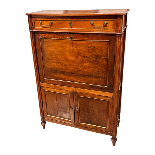 French secrétaire abattant in walnut, with a fall-front writing surface opening to a fitted interior of shelves and small...