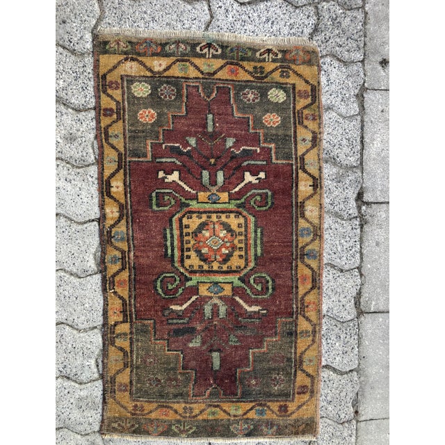 This is a vintage Turkish Oushak rug from the 1960s. The piece was hand-knotted.
