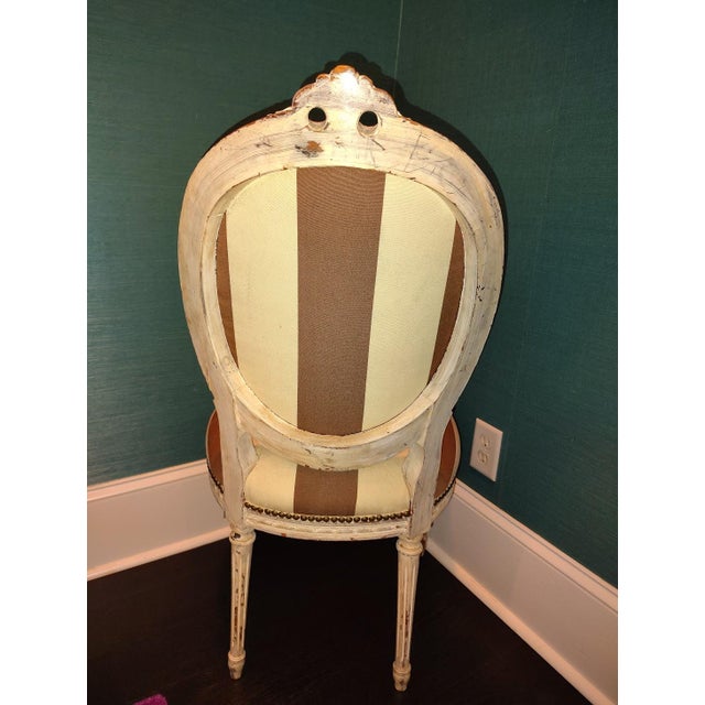 French Late 20th Century Louis XVI Style Dining Room Chair Featuring a Distressed Painted Wooden Frame and Striped Upholstery For Sale - Image 3 of 3