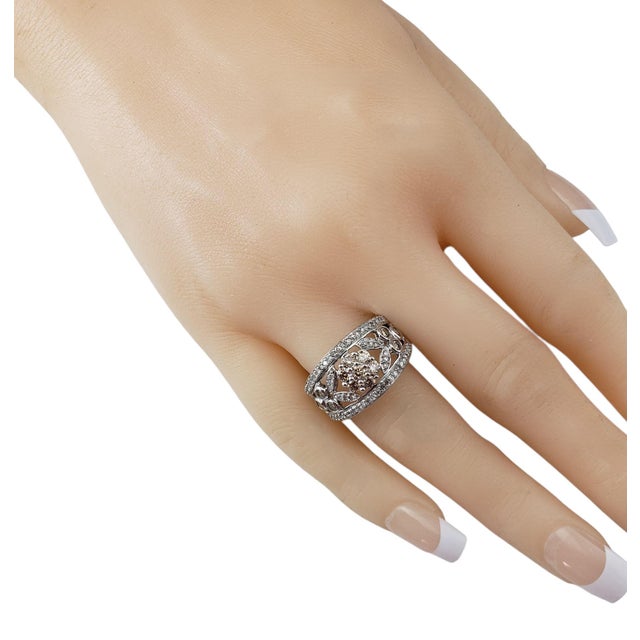 14 Karat White Gold and Diamond Floral Band Ring Size 9 Make a bold yet elegant statement with this stunning 14K white...