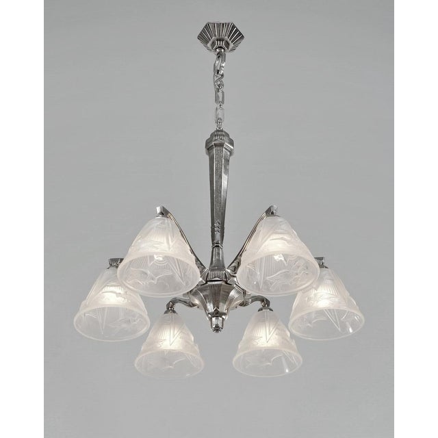 Hettier & Vincent A stunning French art deco chandelier by Hettier et Vincent circa 1930 in nickel plated bronze. The...