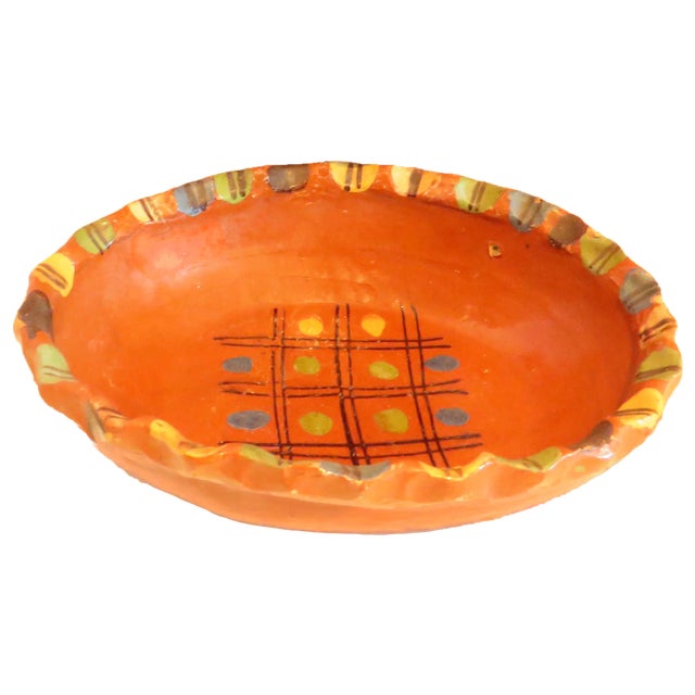 Cheery set of vintage Mexican redware bowls decorated with yellow, blue, and green accents. Thought to have originated in...