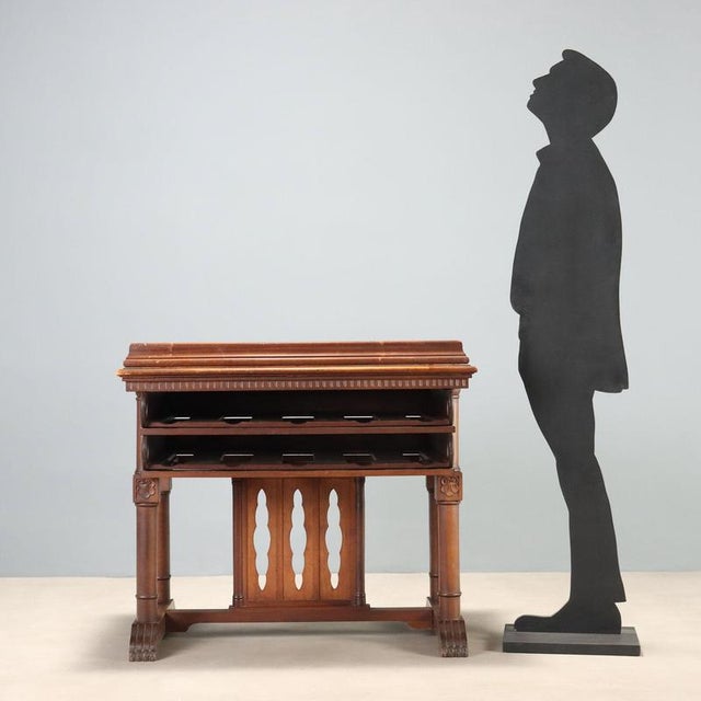 Large walnut library lectern dating from the late 19th century, featuring a reclining top with adjustable inclination via...