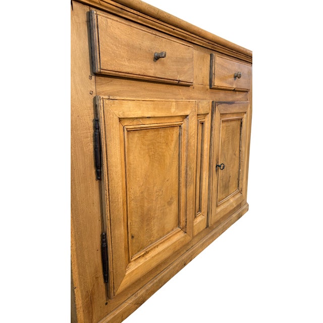 Sideboard in light walnut from the 19th century, with two upper drawers and two doors below, embellished with a beautiful...