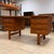 Vintage mid-century Danish modern teak executive desk. Features include a bank of three drawers and slide-out surface on...