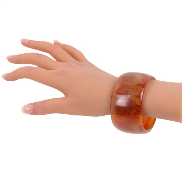 This stunning red tea amber marble Bakelite bracelet bangle features an oversized wide domed shape. The intense red tea...