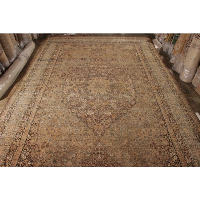 Hand knotted in wool circa 1880-1890, this 13x21 palace size Persian Kermanshah rug is a notable addition to Rug & Kilim’s...