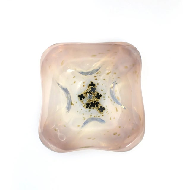 A beautiful and substantial Italian Murano art glass bowl of white opaline, pink, light blue hues and drops of shimmering...