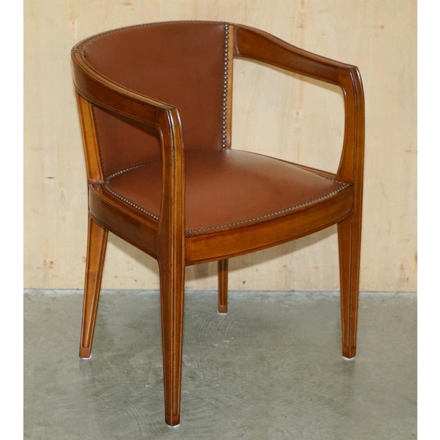 Lovely pair of hand made in paris france, leon jallot, art nouveau brown leather barrel back tub armchairs which are part...