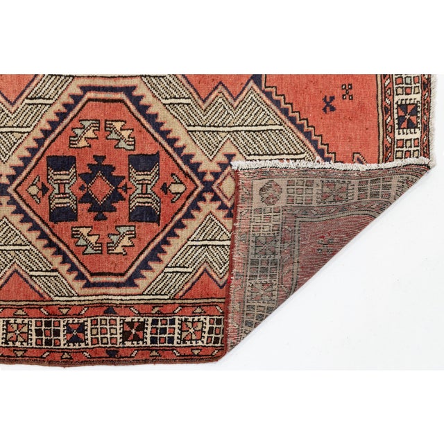 Elevate high-traffic interiors, hallways, or entryway galleries with this striking vintage hand-knotted Kurdish wool...