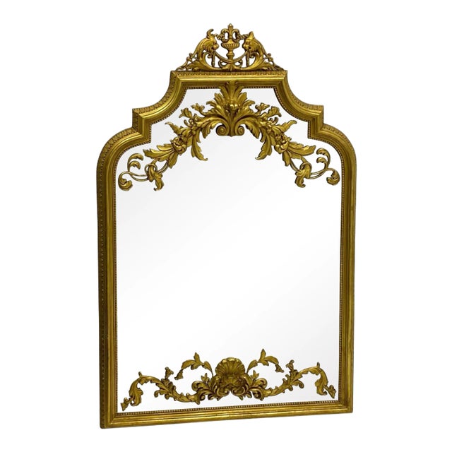 This is an Italian neo-classical style gilt cast plaster mirror with a wonderful carved lion pediment. The rococo style...