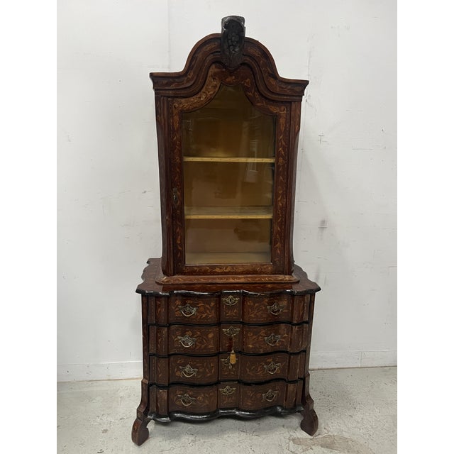 Dutch display cabinet in two parts a chest of drawers in the lower section and a single-door display cabinet in the upper...