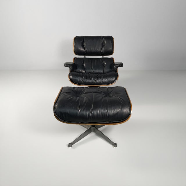American modern armchair and pouf by Charles e Ray Eames, 1970s Armchair and pouf or chaise longue with a wooden shell....