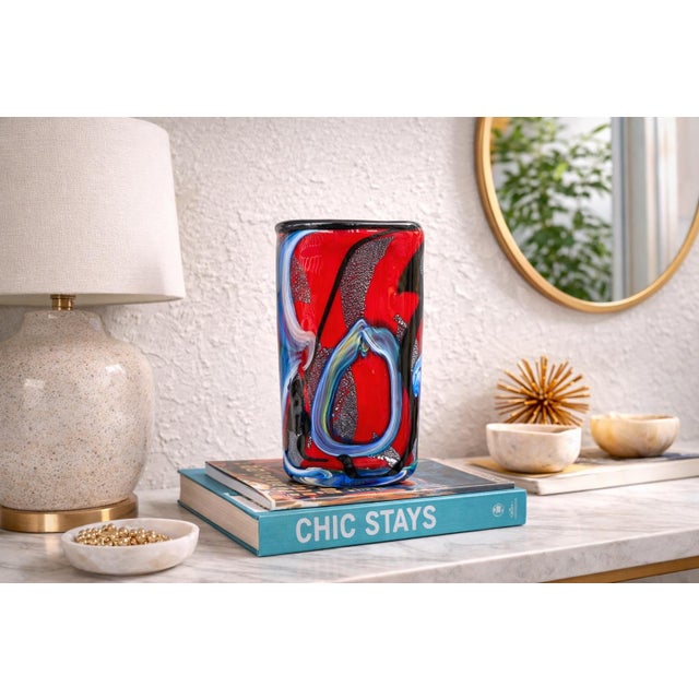 This striking vintage Murano art glass vase showcases the bold, expressive style for which Murano glassmakers are...