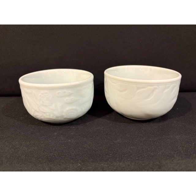 These vintage Korean celadon porcelain bowls, signed Woojung Kiln (牛正窯), feature wildlife (deer & turtle) and lotus raised...