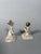 Pair of Mingqi Sculptures, China, Tang Dynasty (618-907). Terracotta sculptures painted with a white and red slip. Depicts...