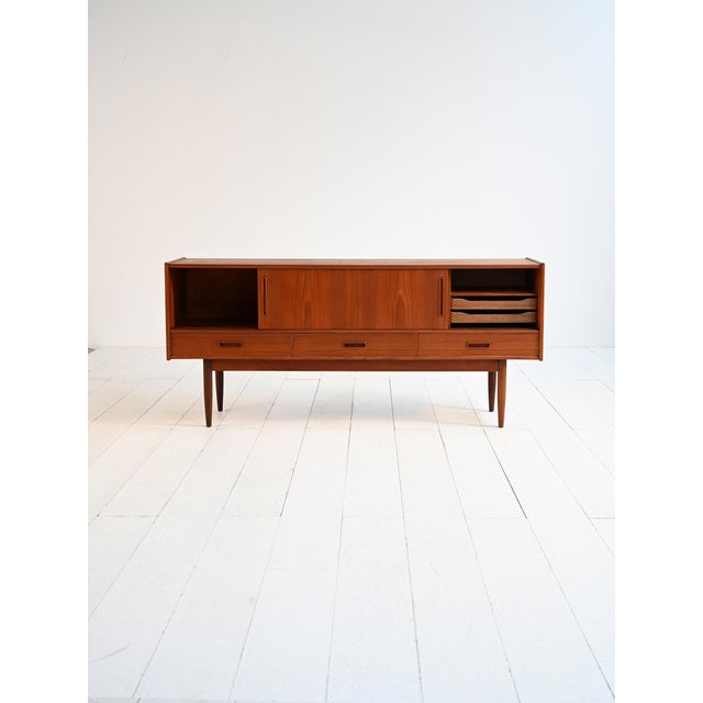 Teak sideboard with four sliding doors and three drawers. Made by Sibast Møbler, Denmark, 1960s. Danish teak sideboard...