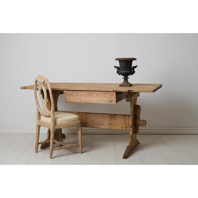 Primitive rustic trestle table in folk art. This table can be used as a dining table and is a classic Swedish folk art...