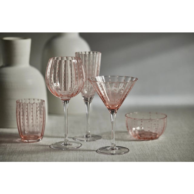 Spice up your dinner parties with glasses that shine. This set of 4 champagne flutes features colored glass with white...