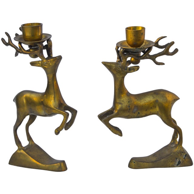 Set of two vintage solid brass reindeer candleholders with ornate details and natural patina. No maker's mark. Shortest;...