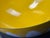 Charming set of mid-century modern yellow enamel nesting bowls. These vibrant bowls feature a bright yellow exterior with...