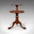 This is an antique country house dumb waiter. An English, mahogany 2-tier serving table, dating to the Georgian period,...