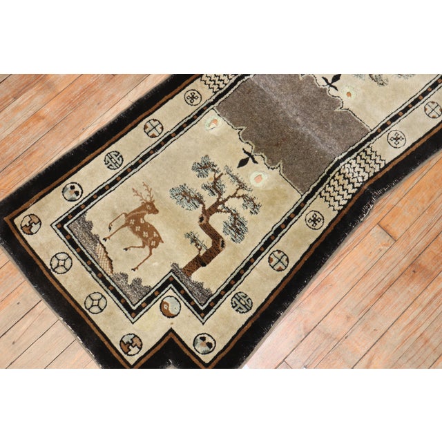 An early 20th-century colorful Tibetan horse cover textile rug. Measures: 2'1'' x 4'7''.