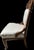 Eastlake Victorian Style chair. Intricately carvedi wood frame and new white scroll pattern fabric. Beautifully upholstered.