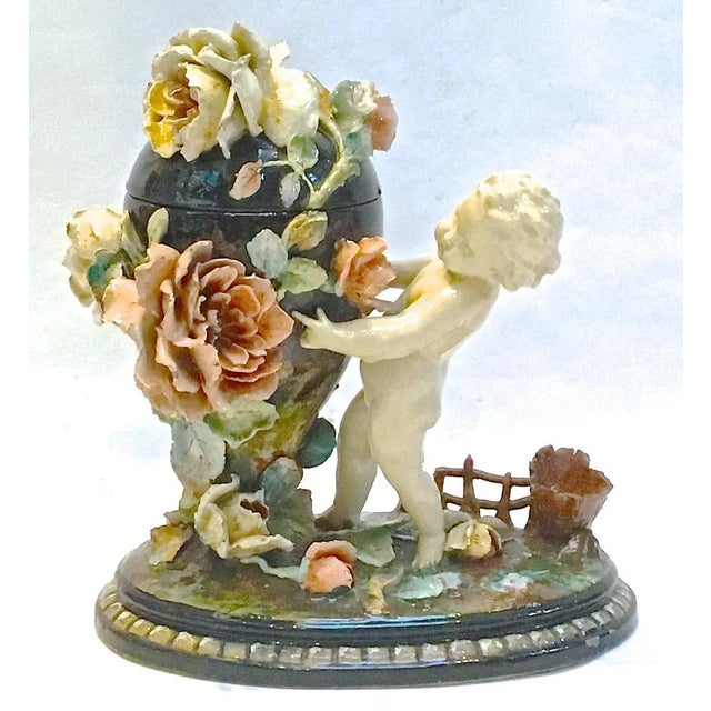 Antique c.1860, French, Barbotine Majolica, cherub and floral, ceramic, urn jar with floral lid. Depicts a ceramic cherub...