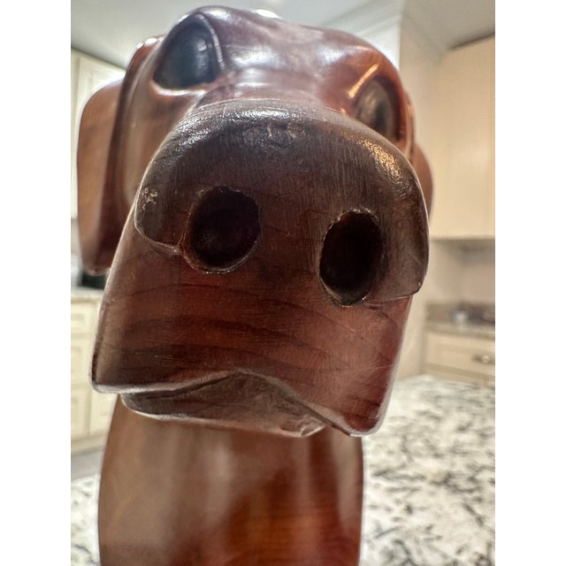 Lovely carved realistic hunting dogs signed by the artist Greg Jordan in 1984. A little over 1 foot tall, approximately 11...
