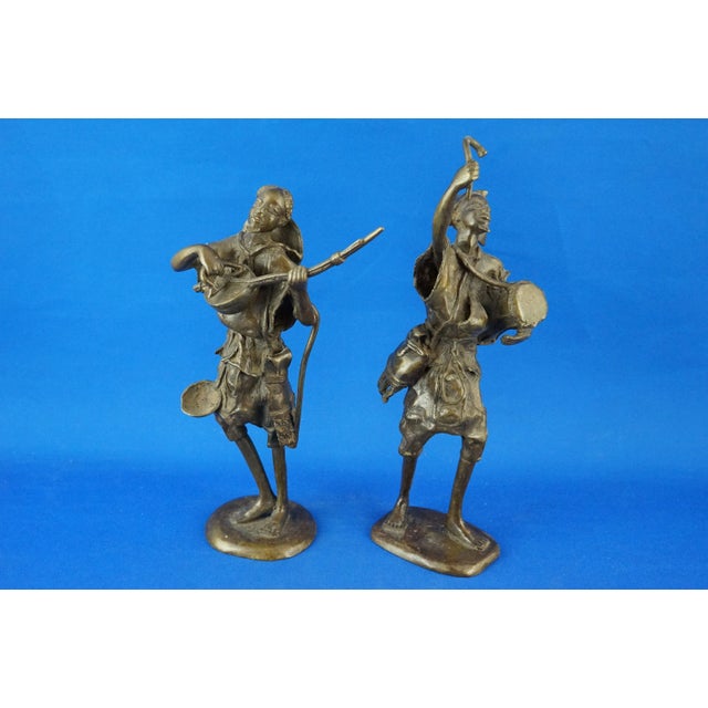 MEASUREMENTS: Guitar player: Height: 30.5 cm; Width: 17 cm; Depth: 9 cm; Drum player: Height: 34 cm; Width: 11 cm; Depth:...