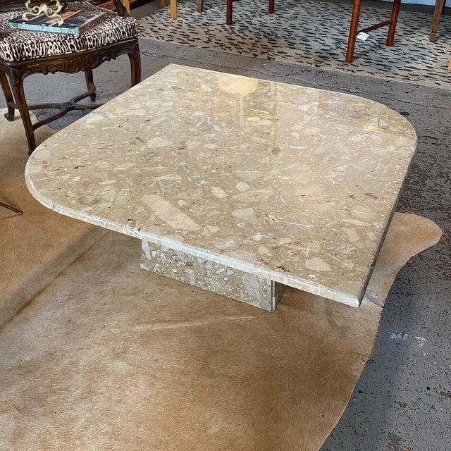 Vintage Italian marble coffee table with beautiful natural veining. In the popular cat eye or teardrop shape. It features...