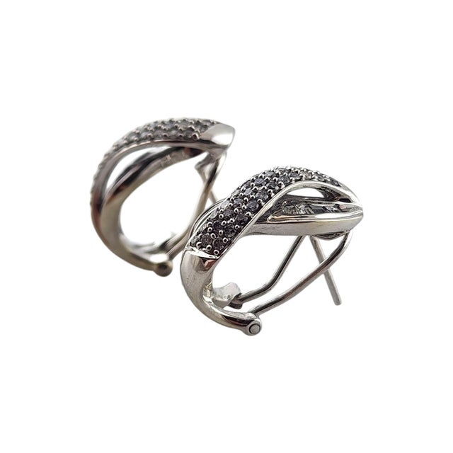 10 Karat White Gold Diamond Crossover Hoop Earrings This beautiful set of hoop earrings have French posts and are...