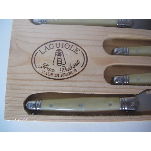 Very nice handmade butter knives/cheese spreaders. These are still in original packaging. I love the bee emblem on the...